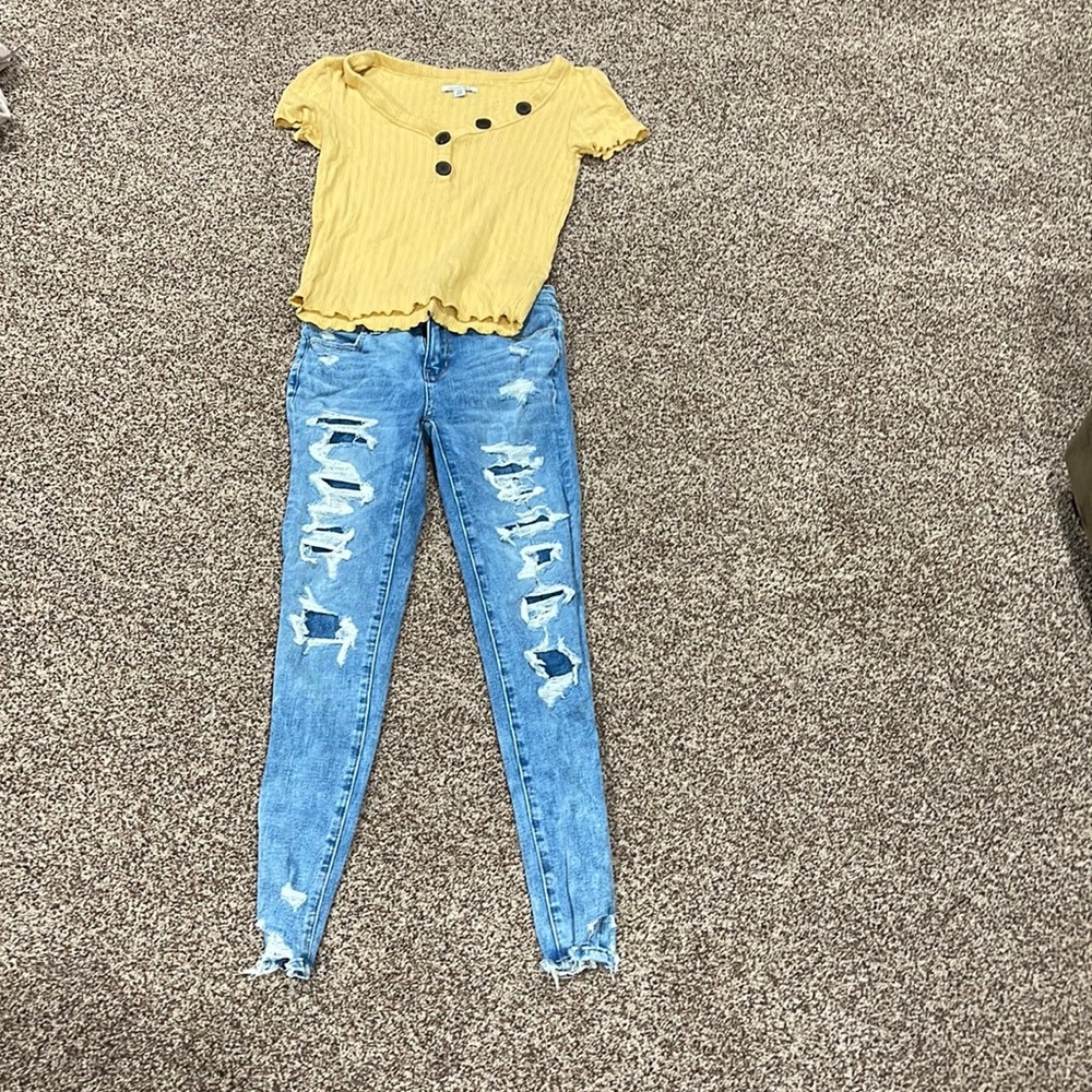 A nice comfy sweater with a low V-neck with blue ripped jeans!!